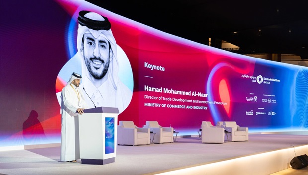 man in traditional arabic dress on stage